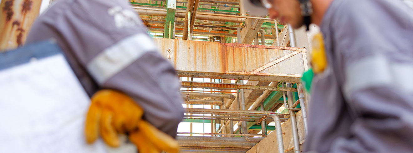 Technicians working on an industrial installation during the preparation phase of an energy sector project