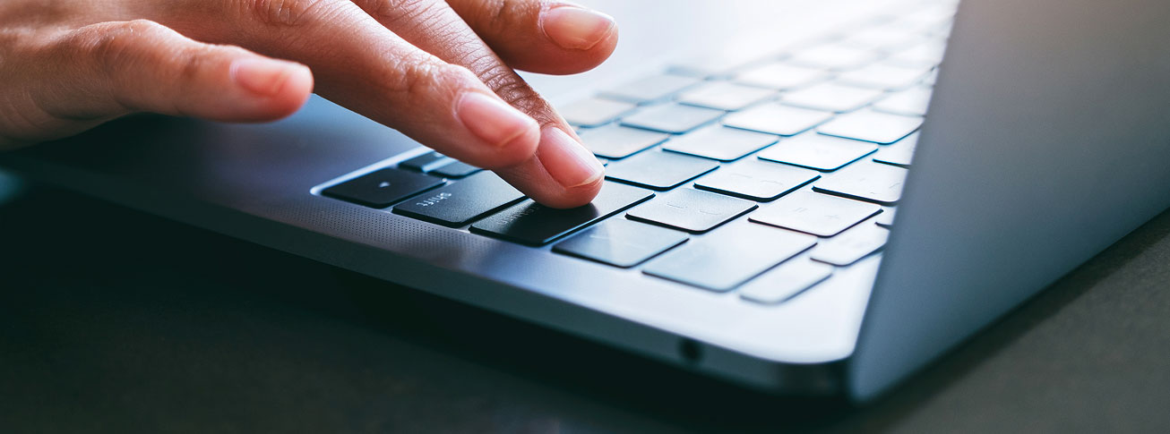 Trainee using a laptop to access online training modules